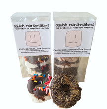 Load image into Gallery viewer, Small clear gift box with mini marshmallow donuts inside, and a logo label around the box