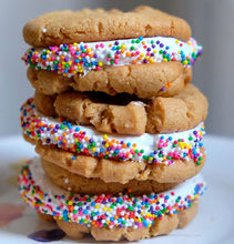 Load image into Gallery viewer, vanilla marshmallow fluff sandwiched in between peanut butter cookies with rainbow sprinkles 