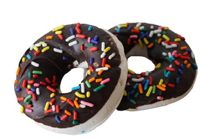Marshmallows in the shape of medium sized donuts, with a chocolate coating