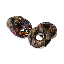 Load image into Gallery viewer, Marshmallows in the shape of medium sized donuts, with a chocolate coating