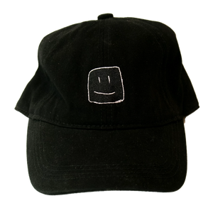 Black baseball cap with white stitching of the Squish Marshmallows logo in front, and name in the back
